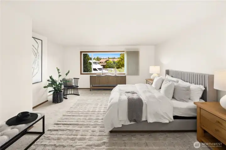 Expansive Primary Suite with views to the water
