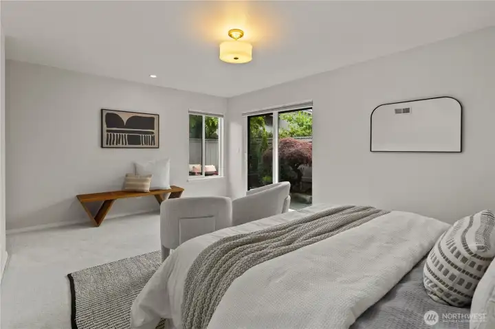 Bright primary bedroom that flows naturally to the garden patio—your own quiet escape