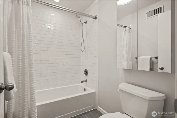 Primary bathroom with full bathtub + shower