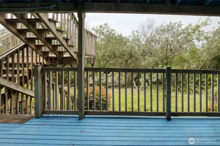 Private Backyard backs to public land and the beach