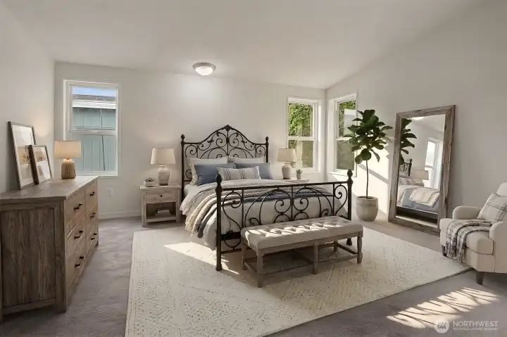 Master bedroom suite with vaulted ceilings, walk in closet and 5 piece bathroom.  Virtually staged photo.