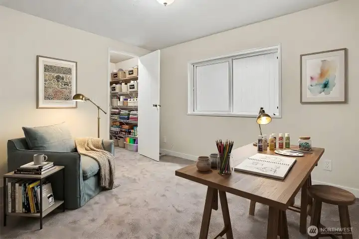 3rd bedroom with a walk in closet, new wall to wall carpet and paint.  Virtually staged photo.