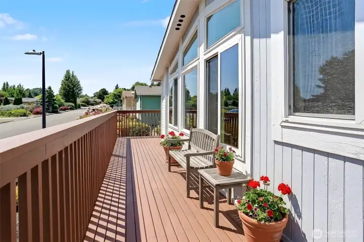 Wrap around front deck with western exposure.  Virtually staged photo.