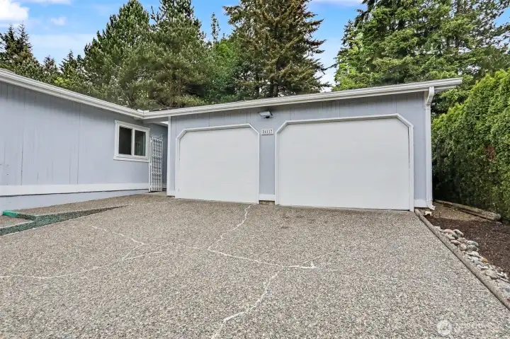 Detached oversized (782 sq ft per SCR) 2 + car garage with workshop space.   Large driveway with off street parking for 2+  more cars.
