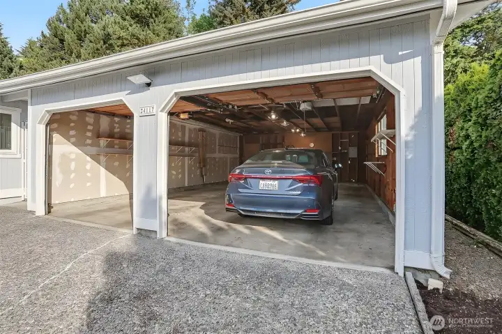 Detached oversized (782 sq ft per SCR) 2 + car garage with workshop space.   Large driveway with off street parking for 2+  more cars.  Virtually staged photo