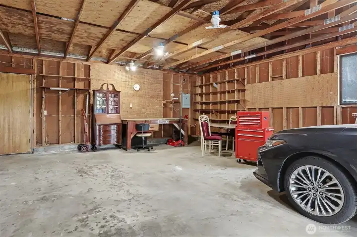 Detached oversized (782 sq ft per SCR) 2 + car garage with workshop space.   Large driveway with off street parking for 2+  more cars.  Virtually staged photo