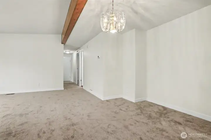 Formal dining room opens to the formal living room. New wall to wall carpet and interior paint.