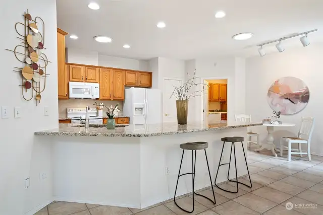 The adjacent breakfast nook space is perfect to sit and relax while sipping your morning beverage. Need more seating? The large breakfast bar could easily accommodate another 3-4 guests.