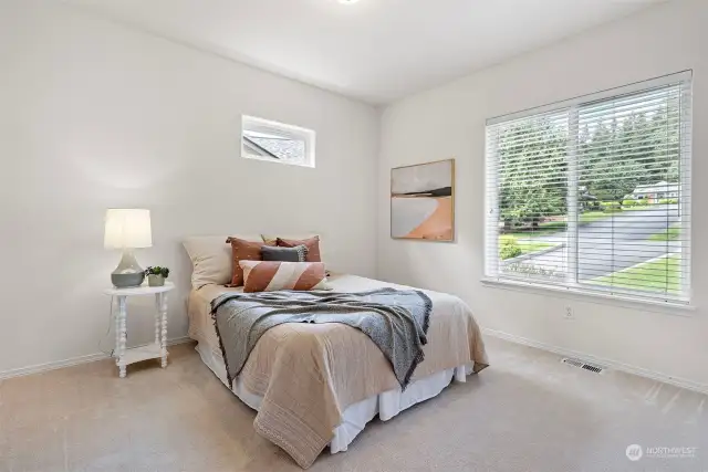 The 2nd bedroom is located at the front of the unit. Again, a transom and large main window make the space bright. A full bath is just steps away off the hall. No sharing your bath with guests in this home.