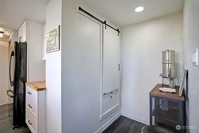 Original pantry & laundry chute repurposed for additional storage.