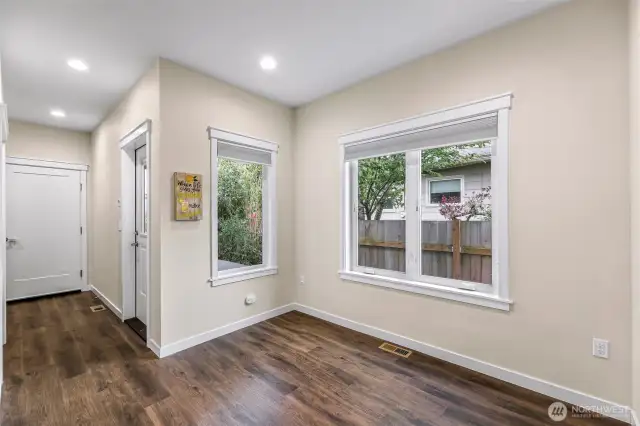 Hallway towards the garage, and door on the right to the patio