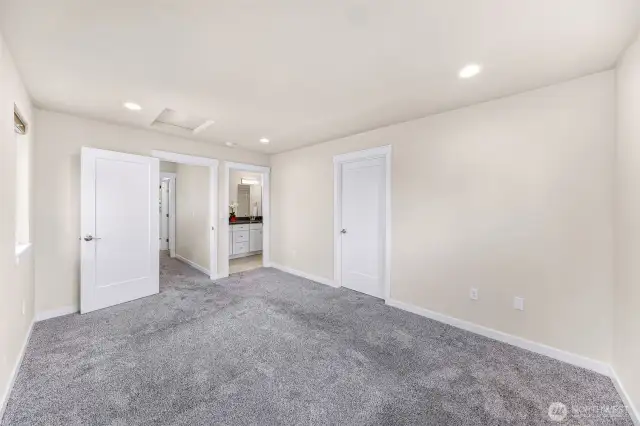 Primary suite, entrance on the left, en suite middle door and walk in closet on the right
