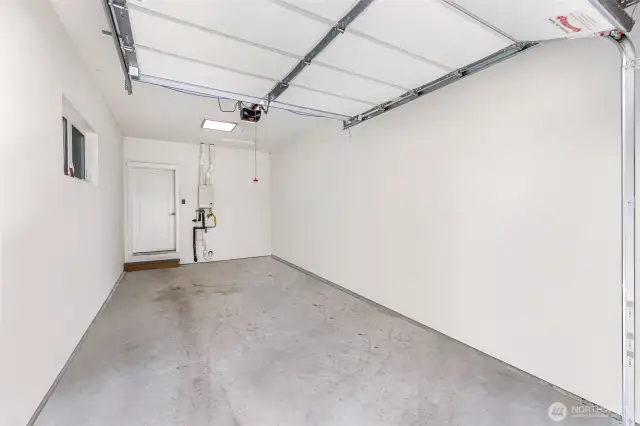 Large single car garage with EV charging.