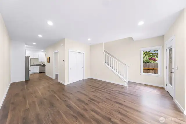 From the living room head toward the main level bedroom and the kitchen