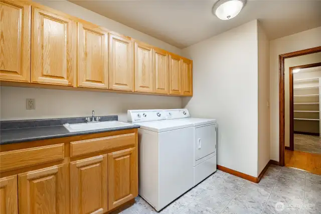 Laundry room and across the hall a storage room/2nd pantry for Costco items