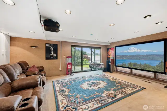 5th bedroom on the lower level is set up as a media room. There is a Murphy bed for guests.