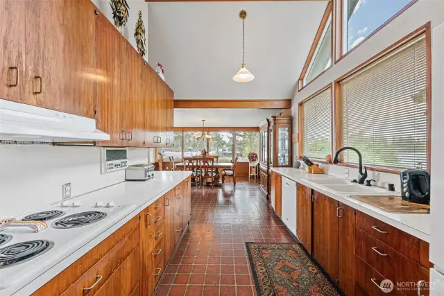 Spacious kitchen with cathedral ceiling.