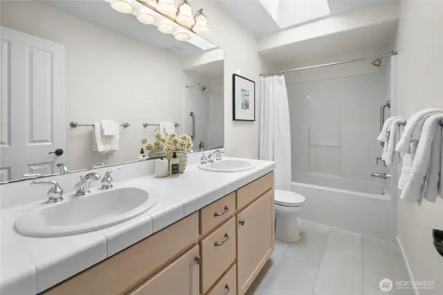 Shared second floor full bath. New floors & sky light.