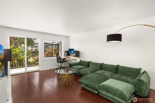 Spacious living room with sliding doors to balcony