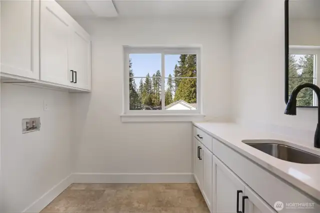 Upstairs utility room with sink
