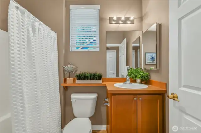 The full bath is adjacent to the second bedroom.