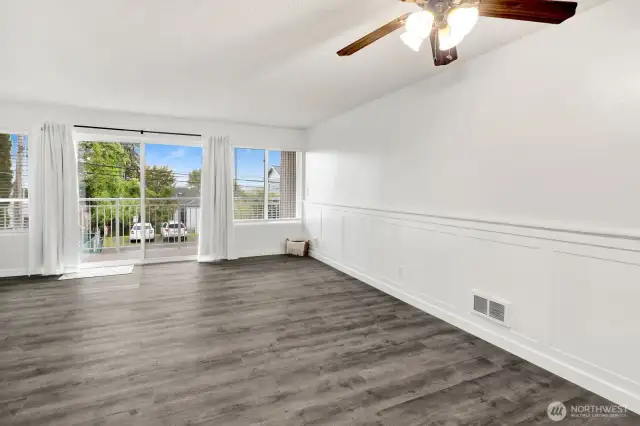 Living room with custom wainscoting and LVP flooring