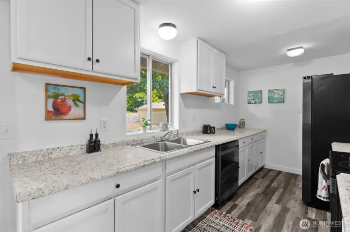 Updated and light-filled kitchen with generous space for the home chef.