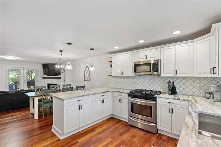Kitchen with dual-fuel oven and brand new microwave.