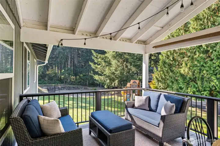 Cozy back deck space with views of the back yard and 100 Acre Woods.