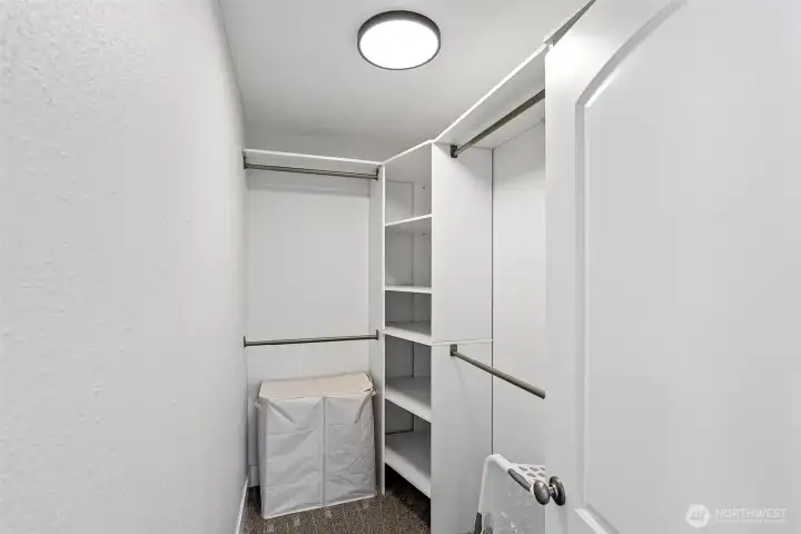 Primary bedroom walk-in closet.