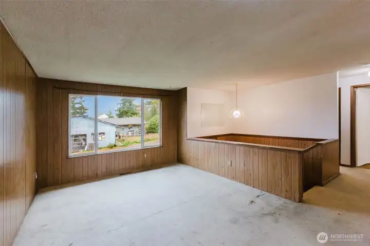 Living room with large picture window for lots of natural light.
