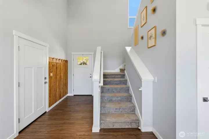 Front door & garage door entry with stairs to 2nd level Front door & garage door entry with stairs to 2nd level