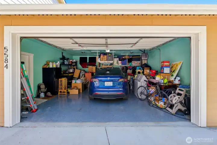 2-car garage with epoxy flooring and built in shelving. 2-car garage with epoxy flooring and built in shelving.