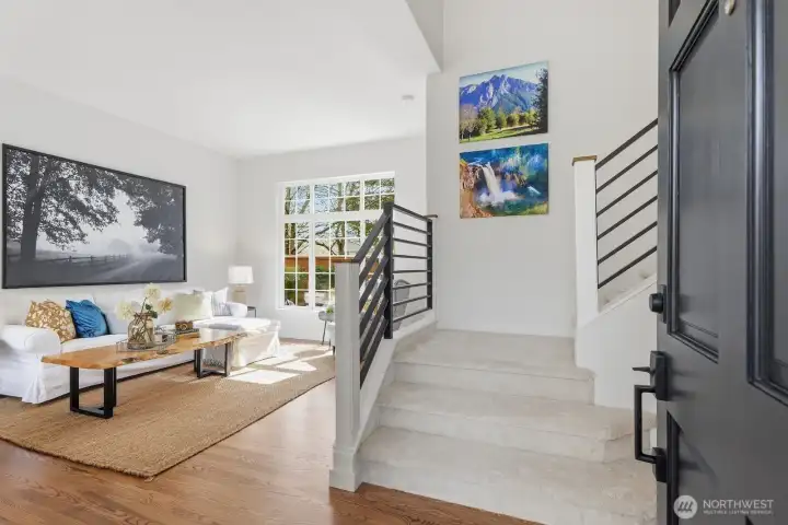 An inviting living room highlighted by vaulted ceilings and abundant natural light.