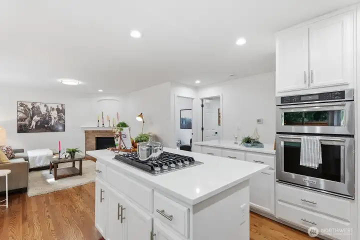 Sleek stainless steel appliances, including a new gas cooktop, add both style and function to the kitchen.