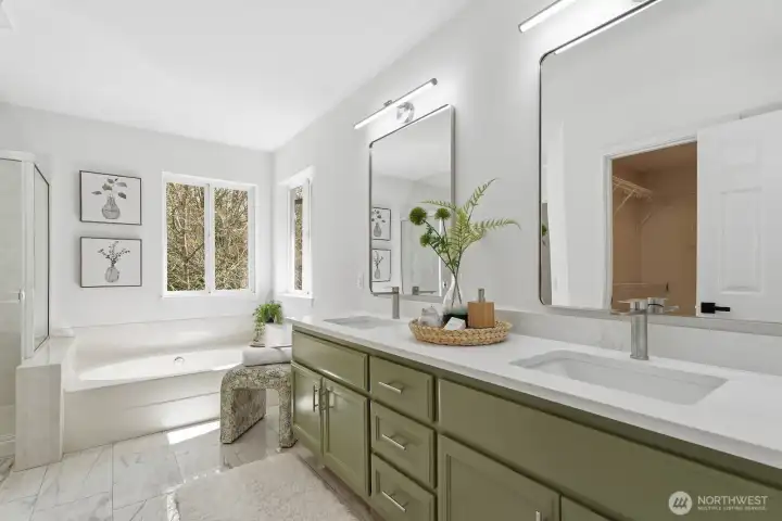 Gorgeous remodeled ensuite bathroom with new tile floors, walk-in shower, soaking tub, and private water closet.