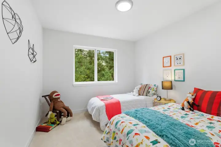 Another oversized bedroom with closet and lovely backyard views.