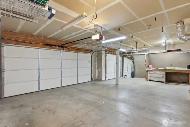 3-car garage with shop area and new LiftMaster 8550W belt-drive opener, including remote, battery backup, and keypad.