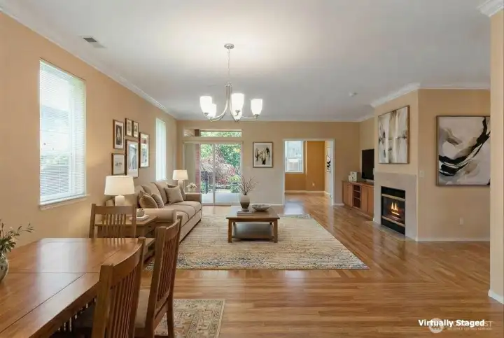 Living room, complete with gas fireplace and hardwood floors through the main living areas.