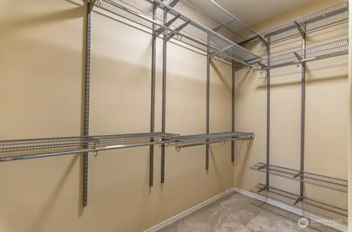 Heavy duty adjustable closet system in the primary closet allows you to make the most of the space and provides extra organization.