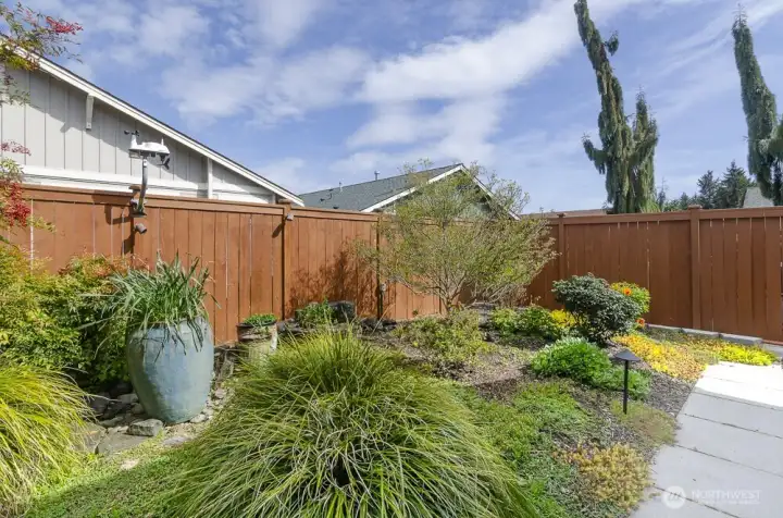 Water feature and mature plantings.  Fully fenced.