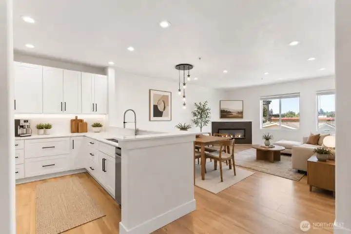 Welcome home! Open concept kitchen, dining and living room. (Virtually staged)