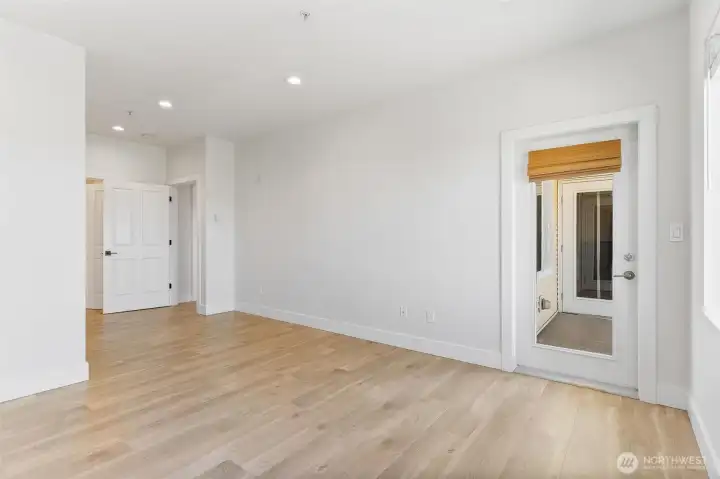 Door to balcony from primary bedroom