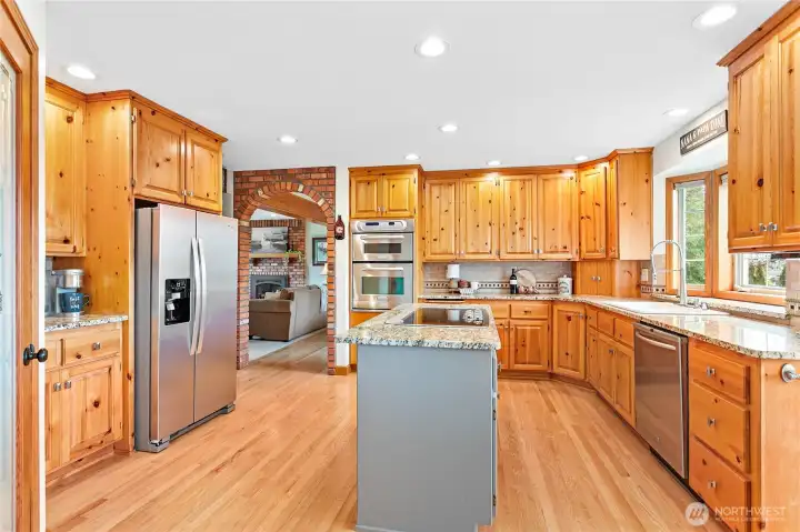 Located between living, dining, and family rooms, this bright & large kitchen is very well-appointed