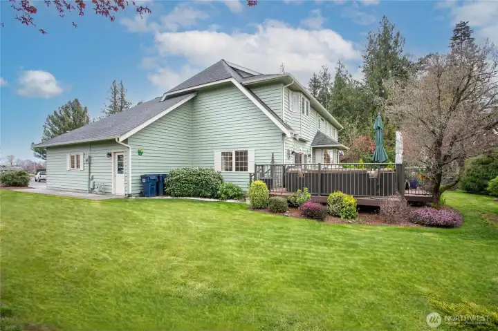 Side-yard also showcases garage entry that can lead to direct basement access for multi-gen living potential