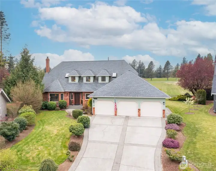 Huge driveway with 3 car epoxy floor garage