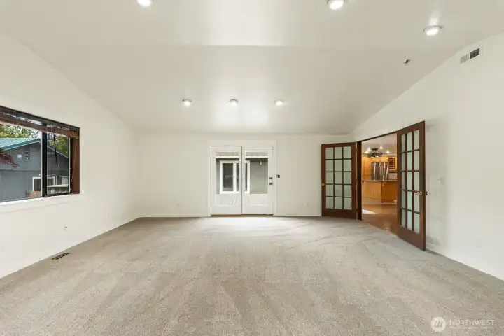 Living Room open to the Dining Room and to back deck