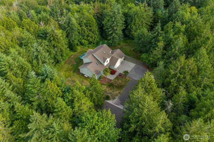 Wooded privacy surround this single-owner home — the skylights visible from above are just one of the thoughtful details you'll find inside. Wooded privacy surround this single-owner home — the skylights visible from above are just one of the thoughtful details you'll find inside.