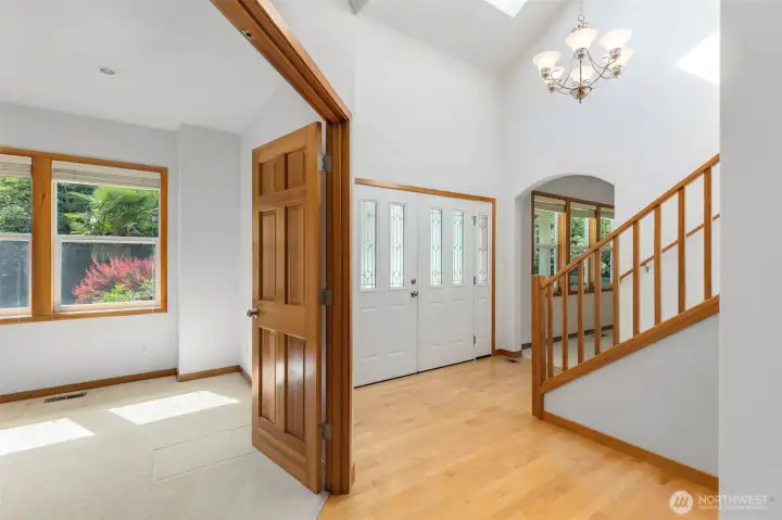 Vaulted ceilings, a skylight, fir trim, and leaded glass sidelights set the tone from the moment you walk in. Office to the left with fir french doors. Vaulted ceilings, a skylight, fir trim, and leaded glass sidelights set the tone from the moment you walk in. Office to the left with fir french doors.