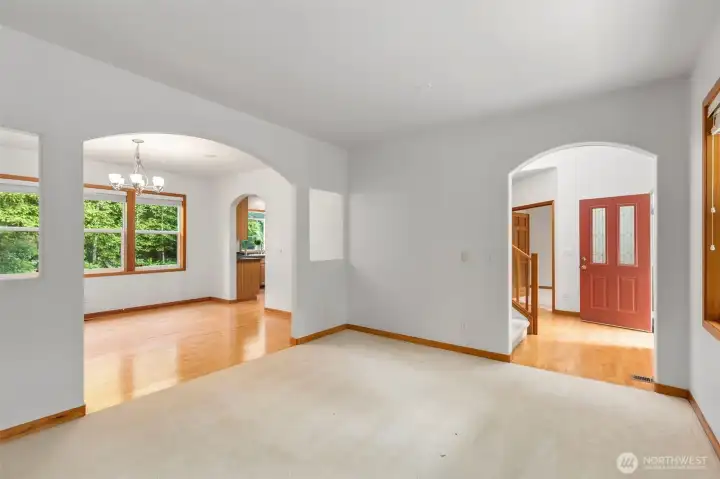 Arched doorways connect the living room, dining room, kitchen, and entry — the floor plan moves intuitively from one space to the next. Arched doorways connect the living room, dining room, kitchen, and entry — the floor plan moves intuitively from one space to the next.